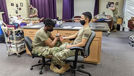 National Guard members in CNA lab at Anoka Tech